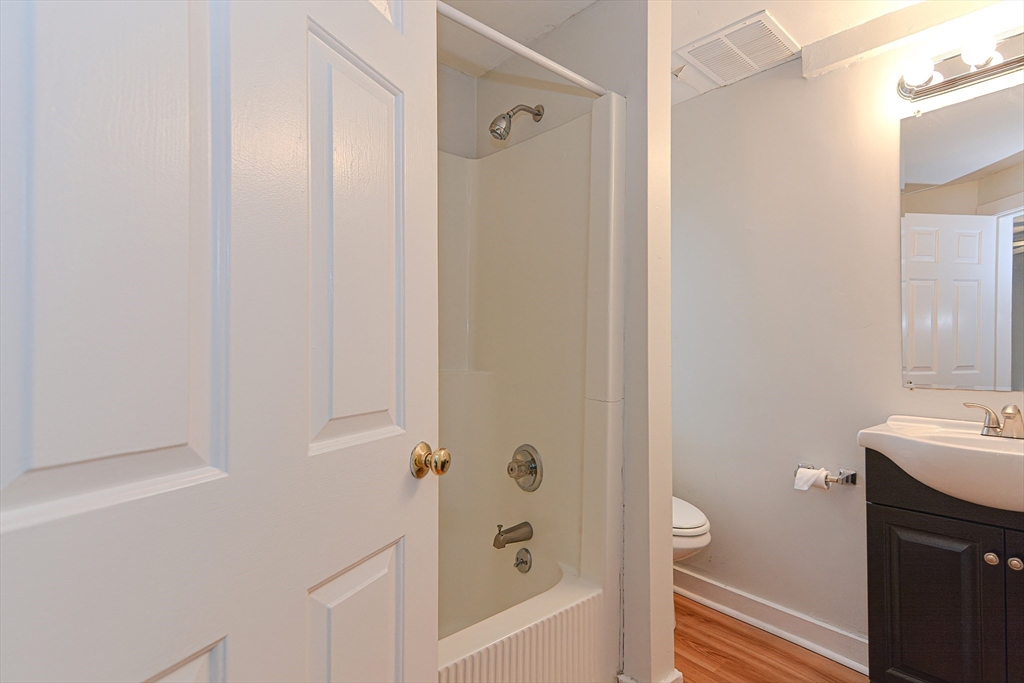2-6 North Main Street Rochester, NH 03867 - Photo 22 of 40 a bathroom with a bathtub and a shower