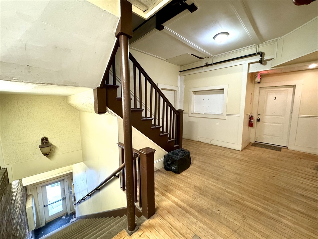2-6 North Main Street Rochester, NH 03867 - Photo 6 of 40 a view of an entryway with wooden floor and door