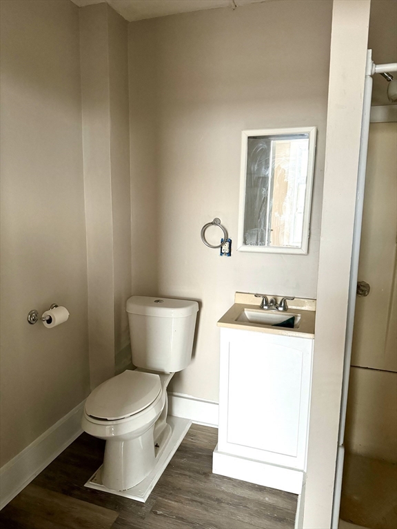 2-6 North Main Street Rochester, NH 03867 - Photo 10 of 40 a white toilet sitting next to a bathroom sink