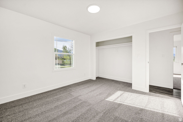 4155 Johnson Road Nibley, UT 84321 - Photo 24 of 71 Unfurnished bedroom with light carpet and a closet