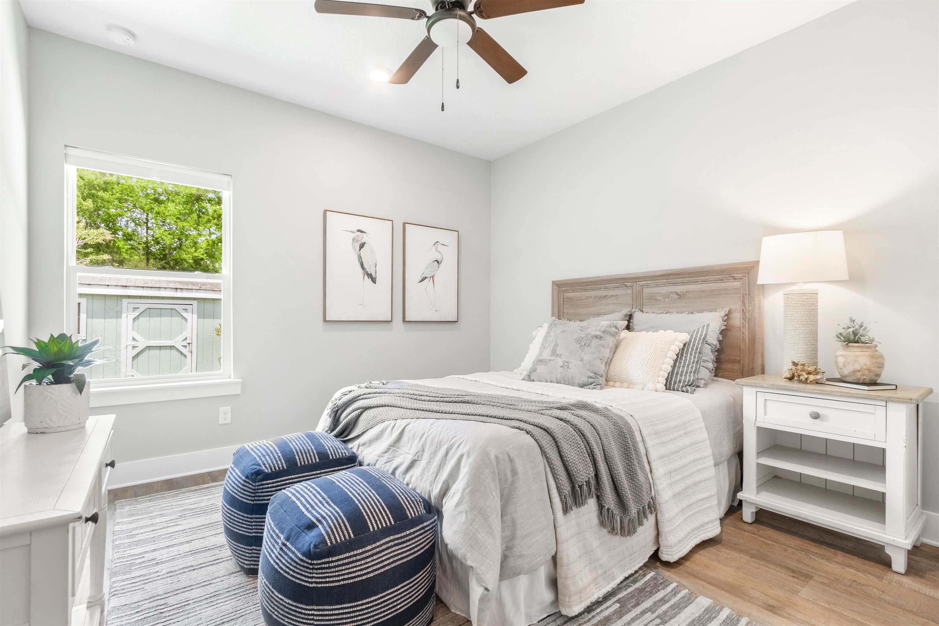 6779 Magnolia Lane St. Augustine, FL 32086 - Photo 18 of 61 a bedroom with a bed and a chandelier