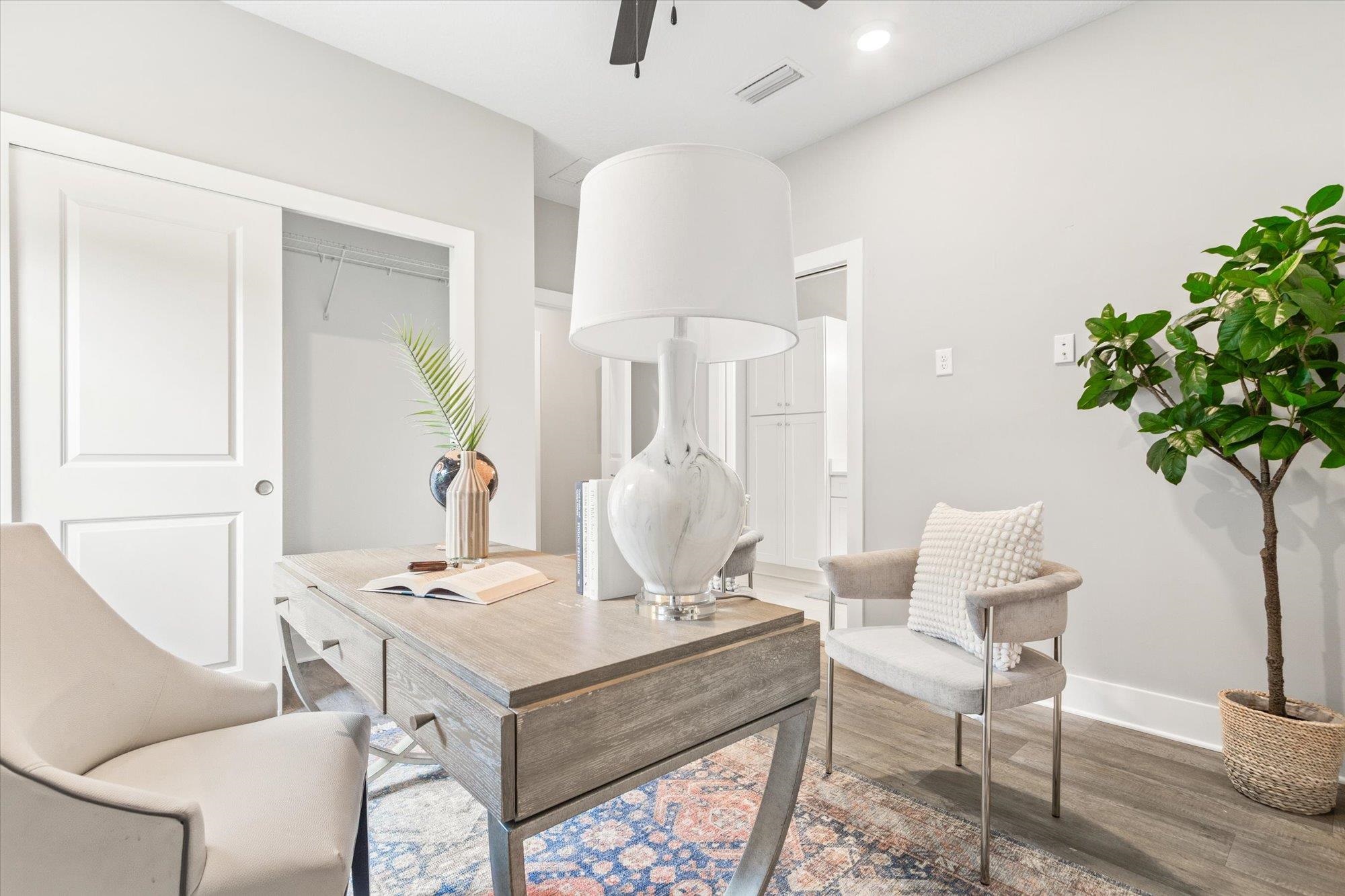 6779 Magnolia Lane St. Augustine, FL 32086 - Photo 26 of 61 a living room with furniture and a chandelier