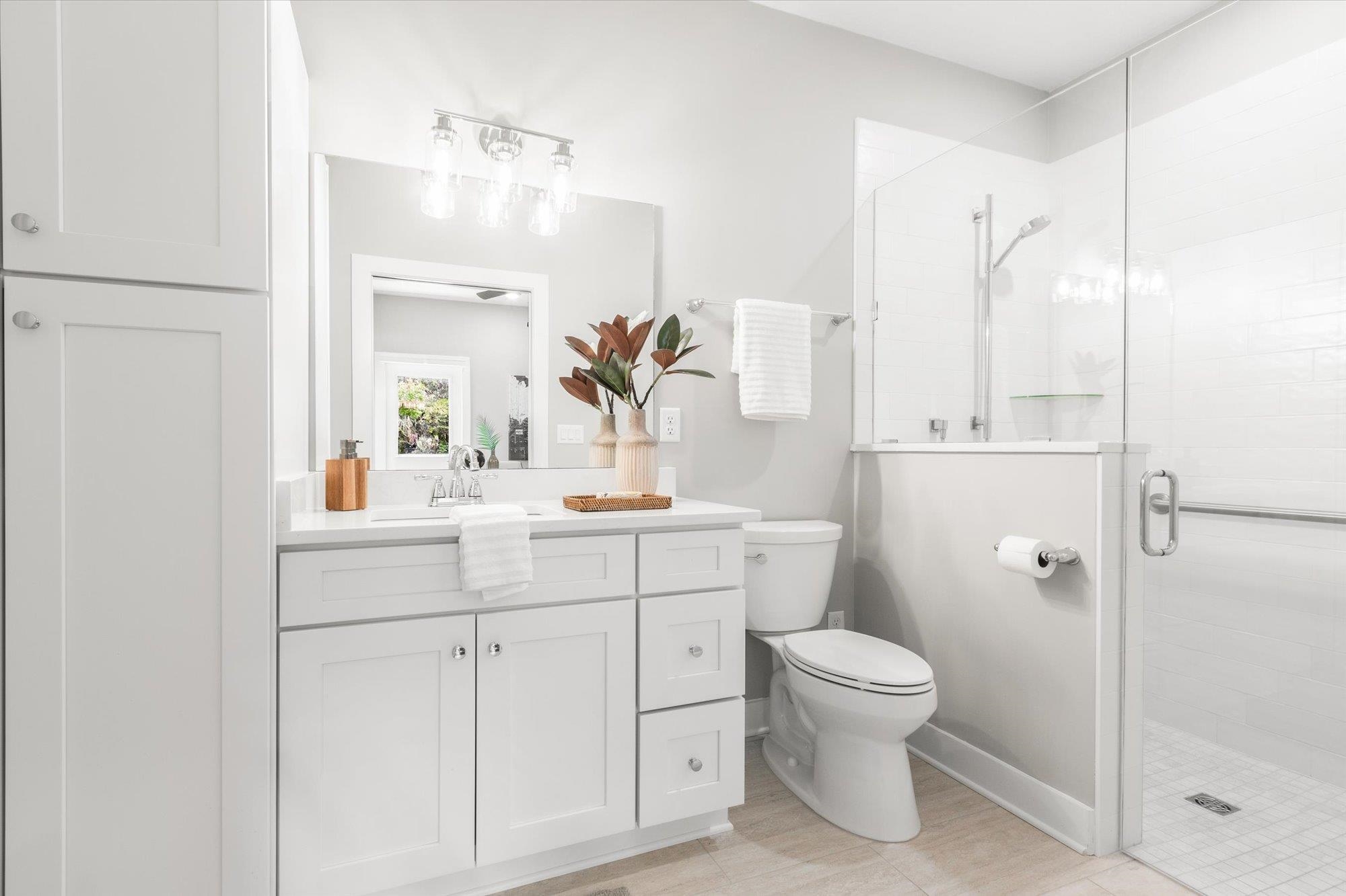 6779 Magnolia Lane St. Augustine, FL 32086 - Photo 27 of 61 a bathroom with a sink a toilet and shower