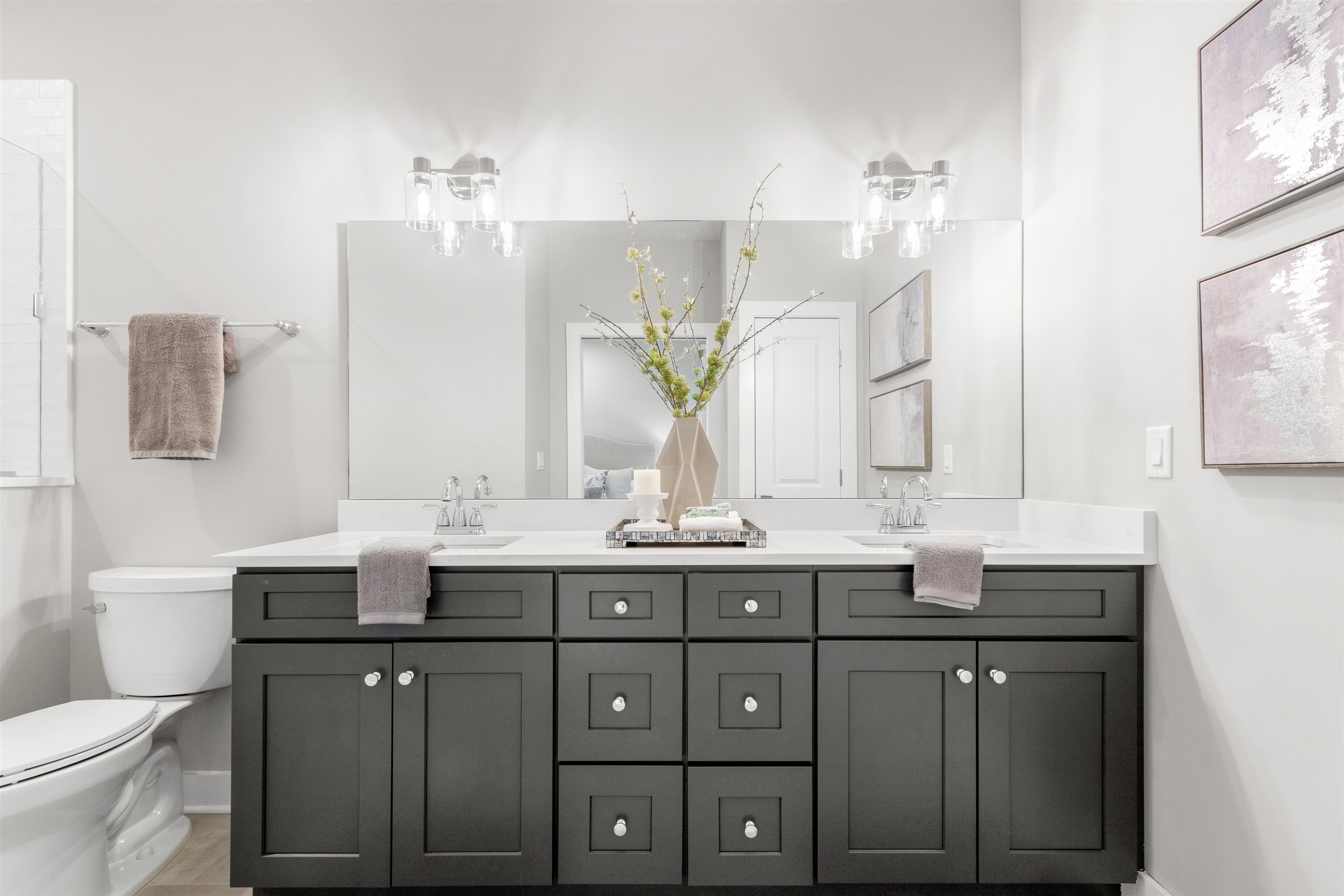 6779 Magnolia Lane St. Augustine, FL 32086 - Photo 30 of 61 Full bathroom with double vanity and baseboards
