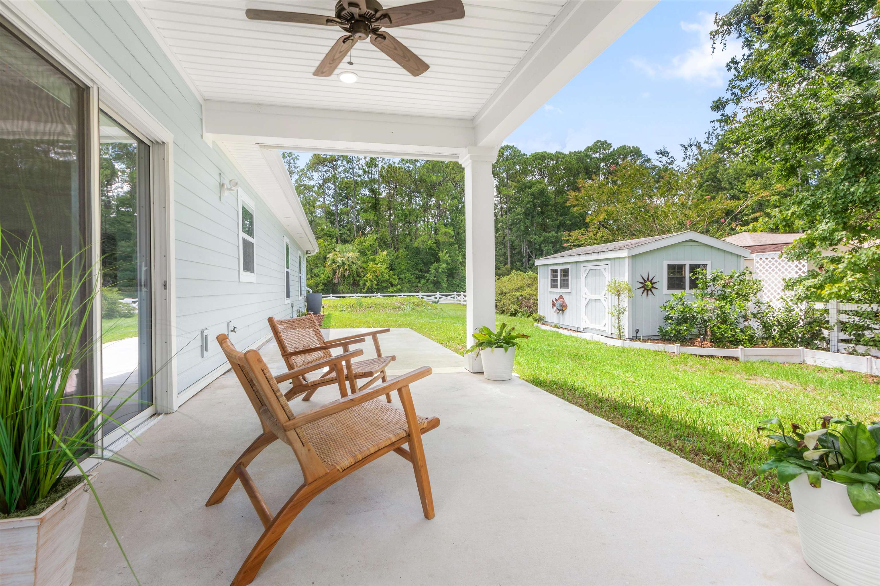 6779 Magnolia Lane St. Augustine, FL 32086 - Photo 33 of 61 a view of a patio with a yard
