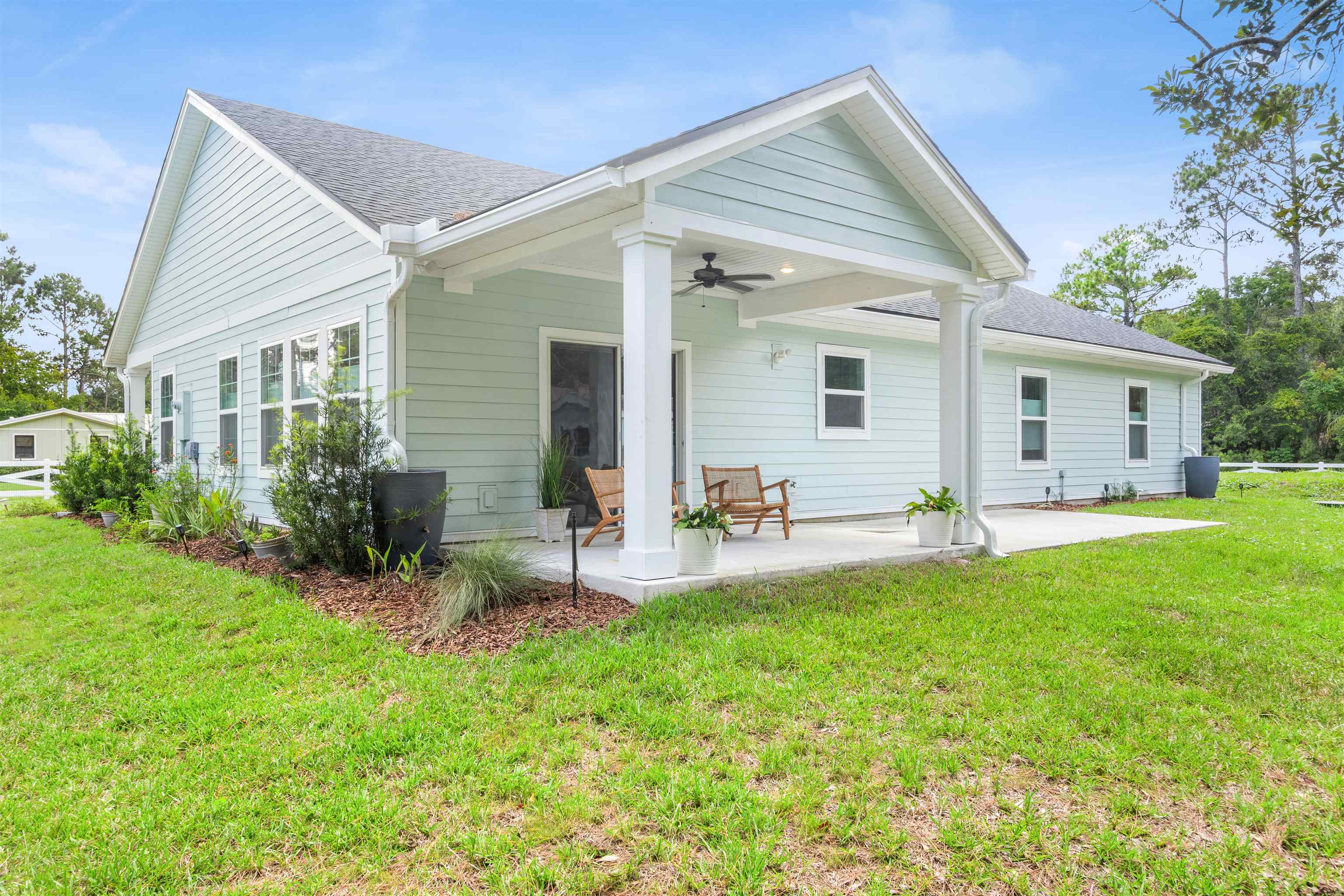 6779 Magnolia Lane St. Augustine, FL 32086 - Photo 34 of 61 a view of a house with backyard and sitting area