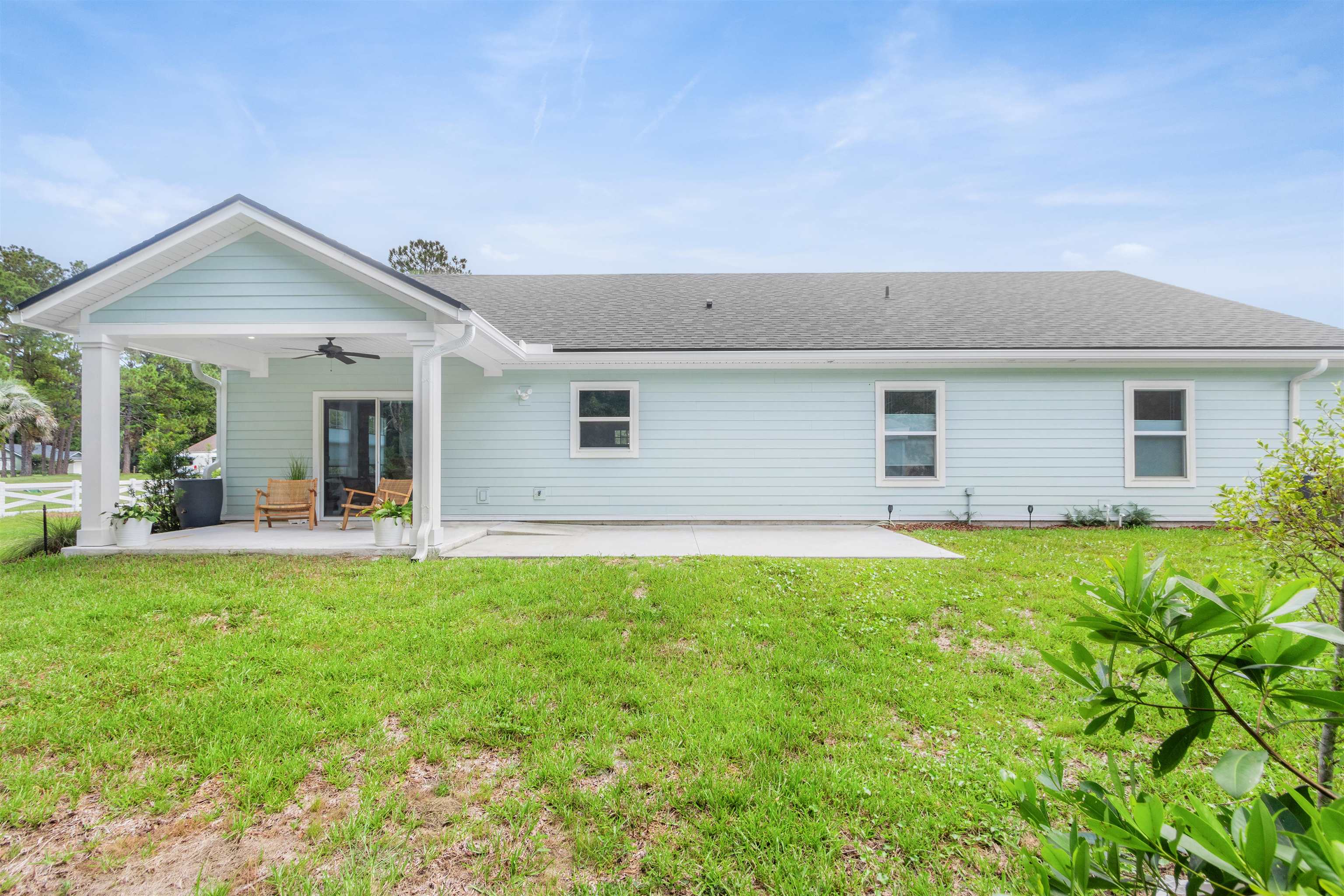 6779 Magnolia Lane St. Augustine, FL 32086 - Photo 35 of 61 a view of a house with backyard and porch
