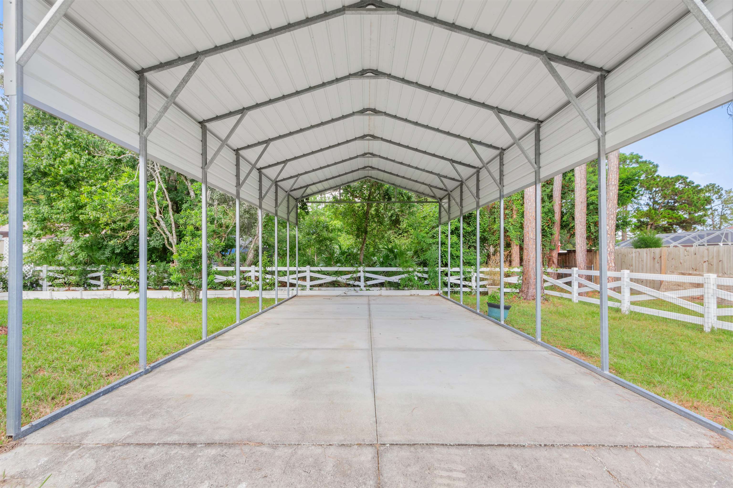 6779 Magnolia Lane St. Augustine, FL 32086 - Photo 36 of 61 a view of a backyard with porch