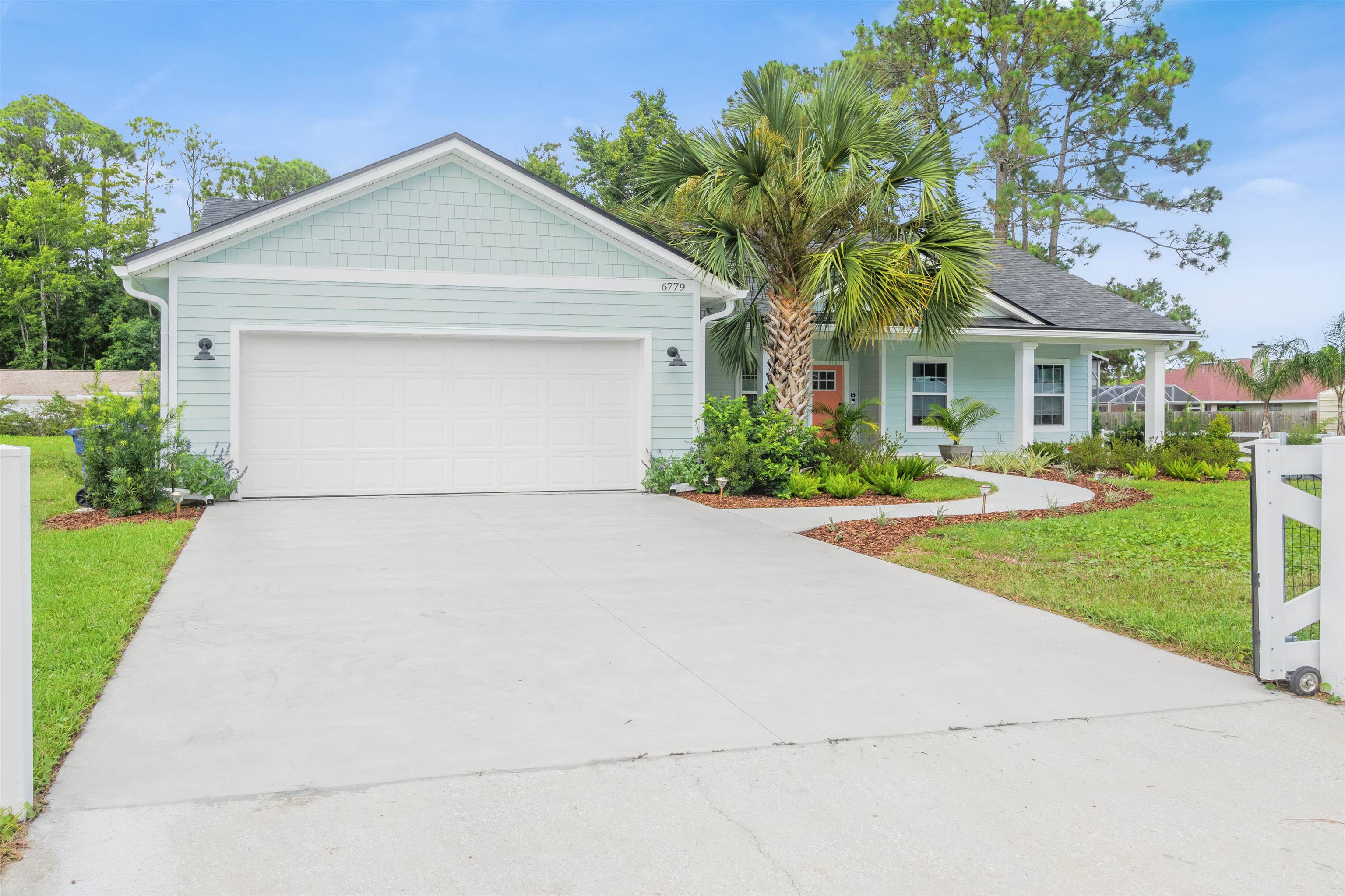 6779 Magnolia Lane St. Augustine, FL 32086 - Photo 42 of 61 a front view of house with yard and green space