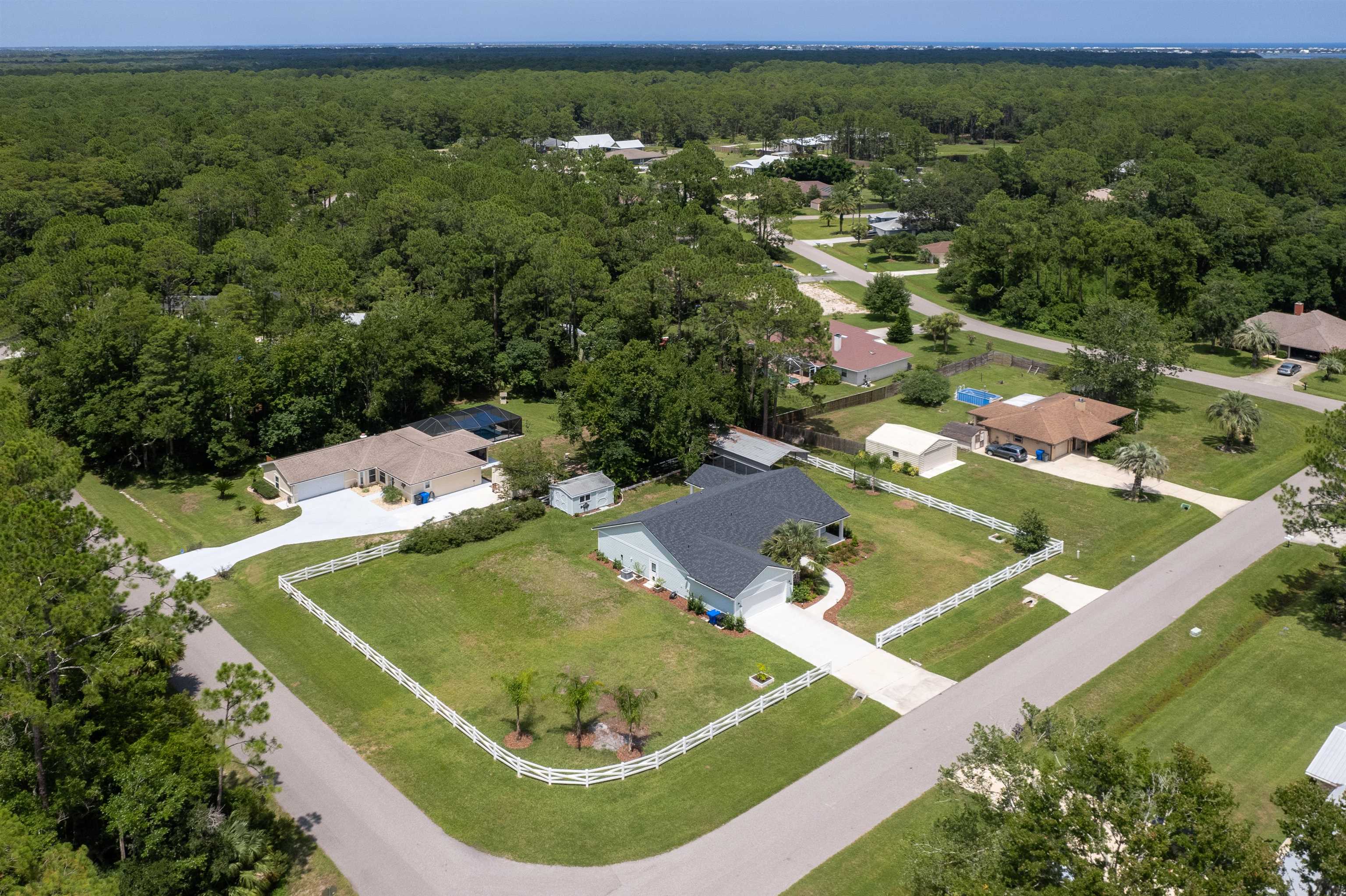 6779 Magnolia Lane St. Augustine, FL 32086 - Photo 49 of 61 an aerial view of a house with a yard and outdoor seating