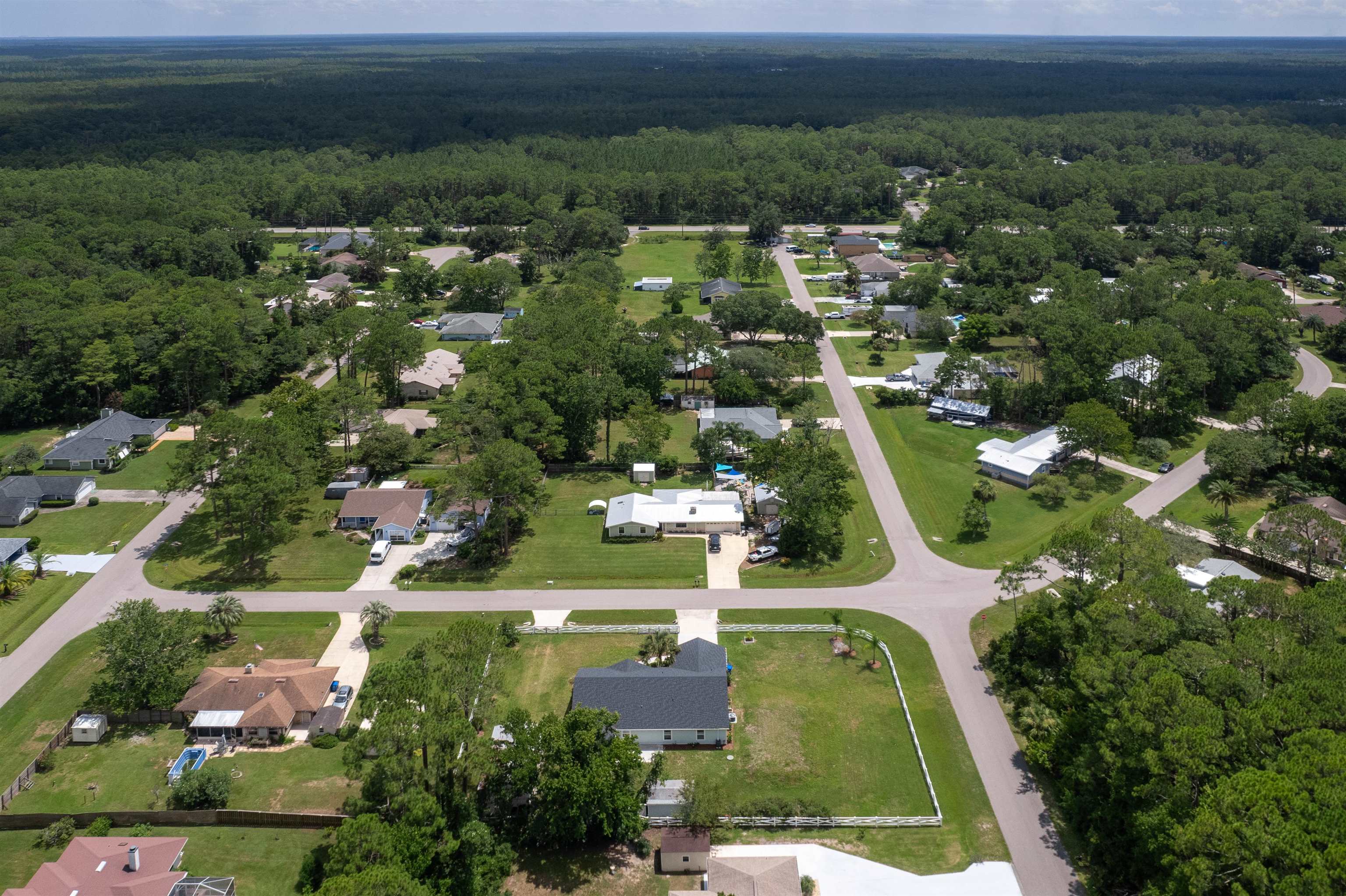 6779 Magnolia Lane St. Augustine, FL 32086 - Photo 52 of 61 an aerial view of residential houses with outdoor space and trees