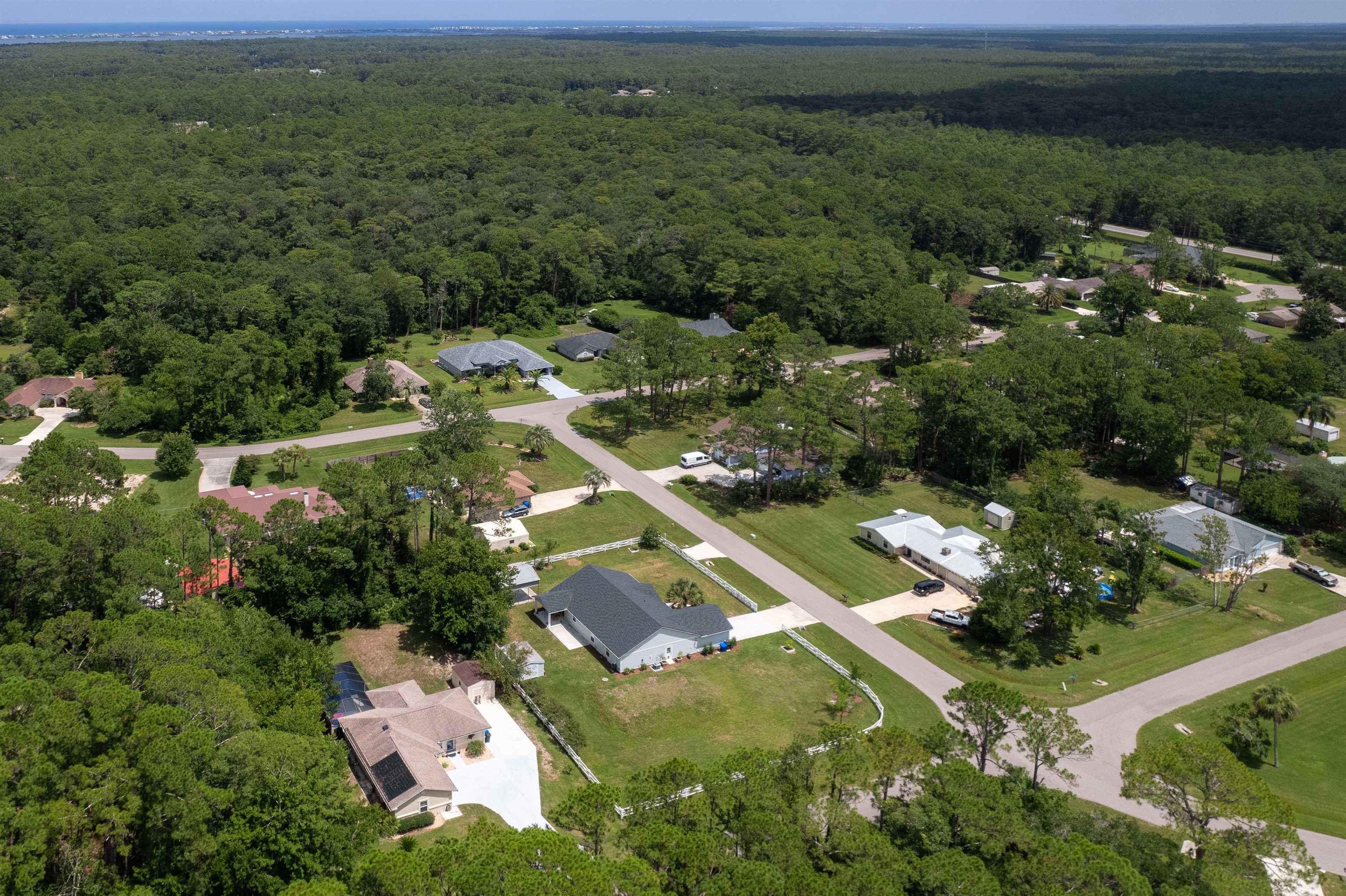 6779 Magnolia Lane St. Augustine, FL 32086 - Photo 53 of 61 an aerial view of residential houses with outdoor space and trees