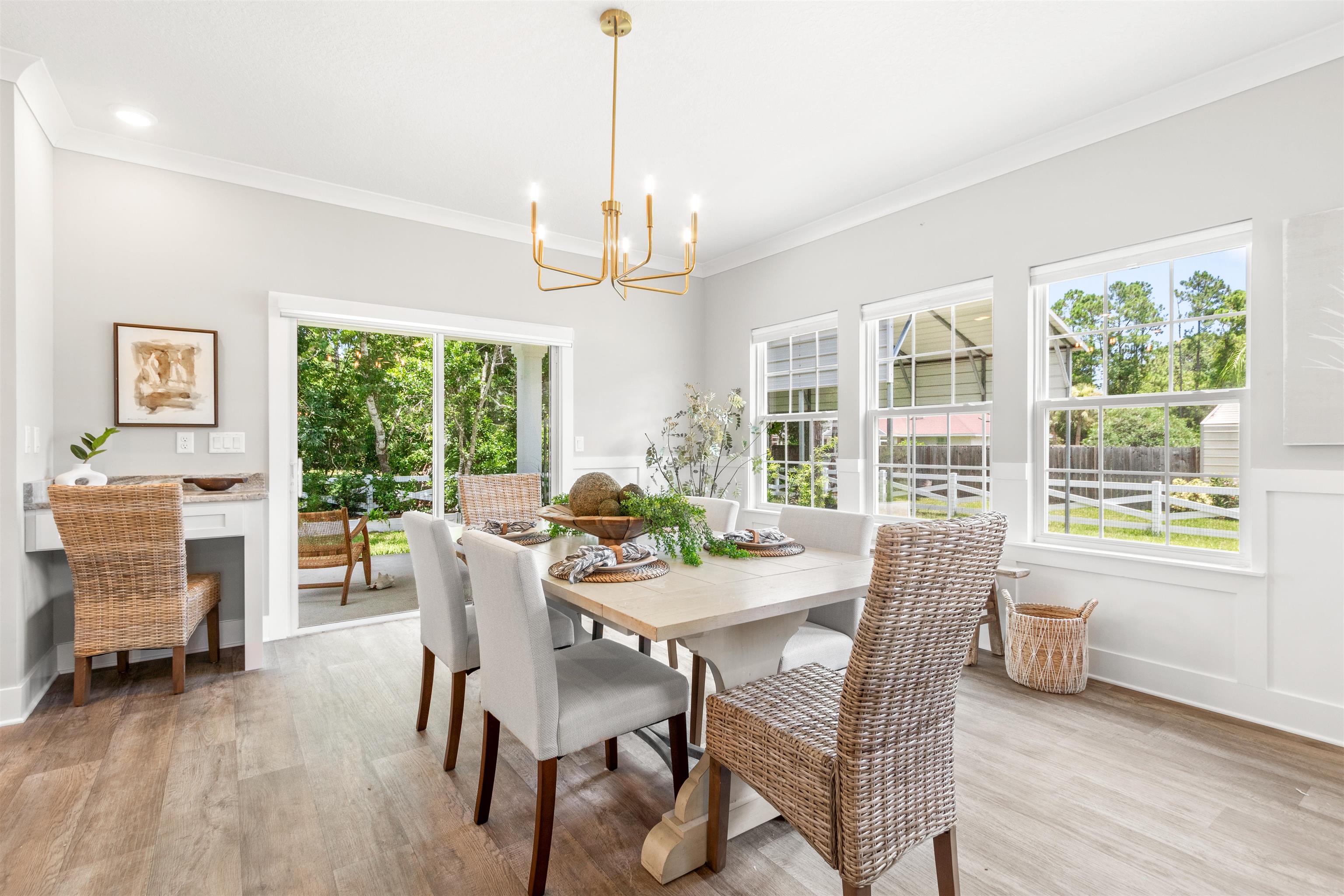 6779 Magnolia Lane St. Augustine, FL 32086 - Photo 7 of 61 a view of a dining room with furniture window and outside view