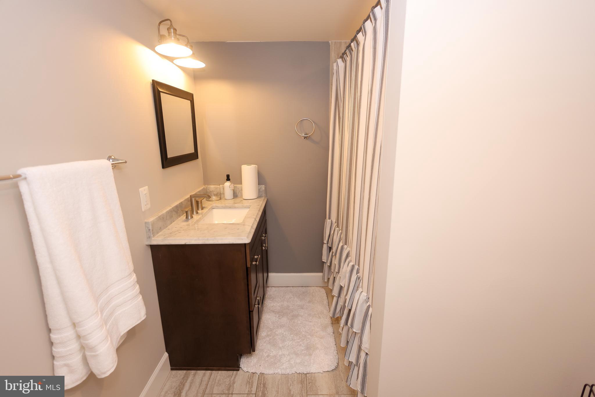 16600 Bald Eagle School Road Brandywine, MD 20613 - Photo 14 of 29 a bathroom with a sink and mirror