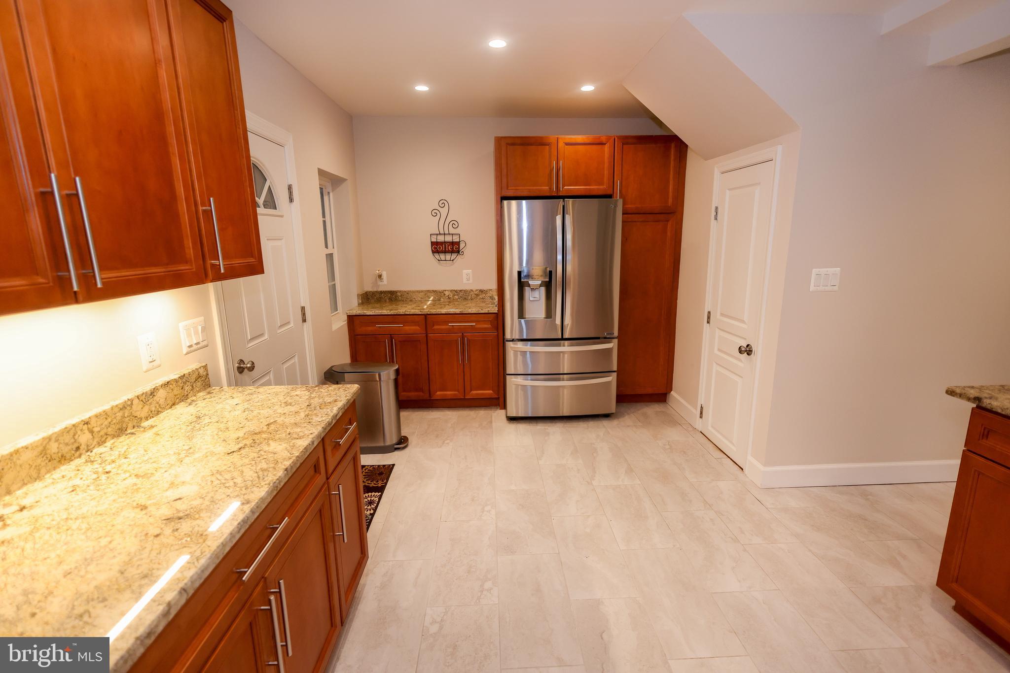 16600 Bald Eagle School Road Brandywine, MD 20613 - Photo 4 of 29 a kitchen with refrigerator and cabinets