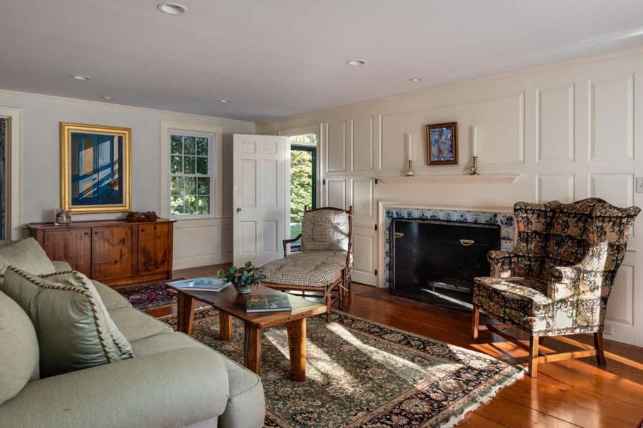 149 East Bay Road Osterville, MA 02655 - Photo 12 of 39 a living room with furniture and a fireplace