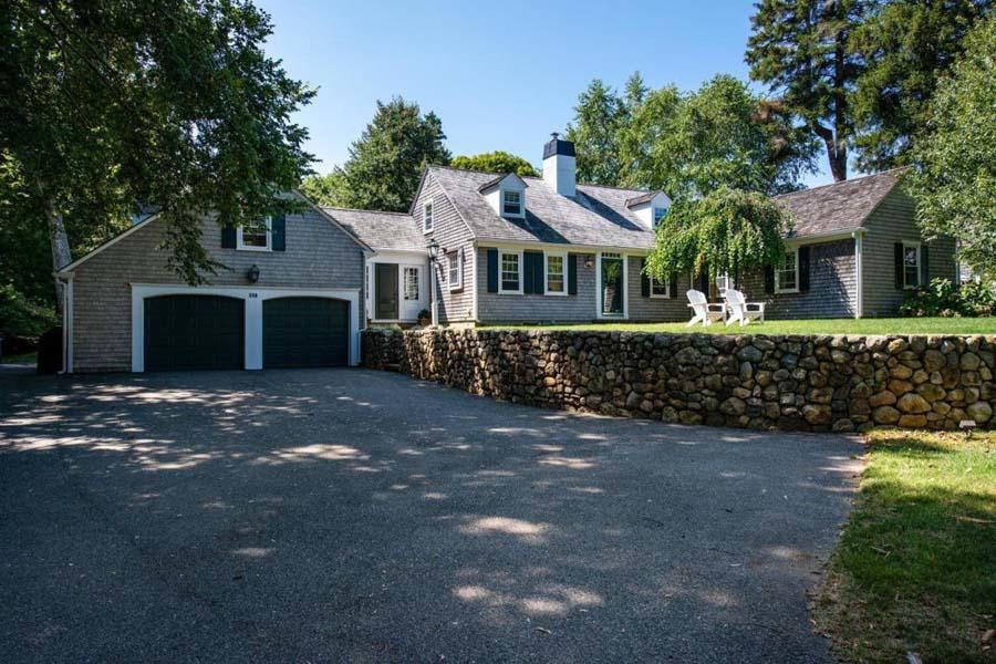 149 East Bay Road Osterville, MA 02655 - Photo 2 of 39 a front view of a house with a garden