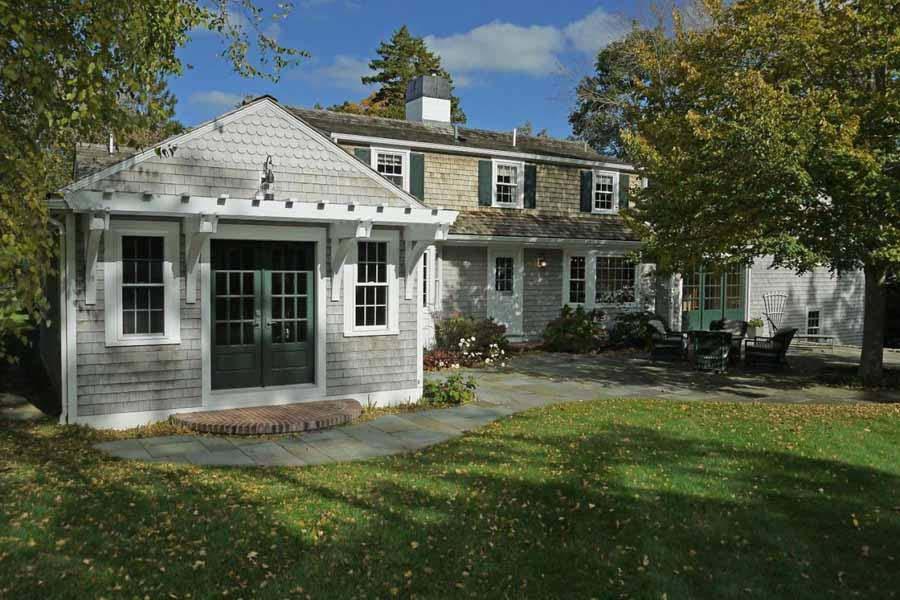 149 East Bay Road Osterville, MA 02655 - Photo 3 of 39 a front view of a house with a garden