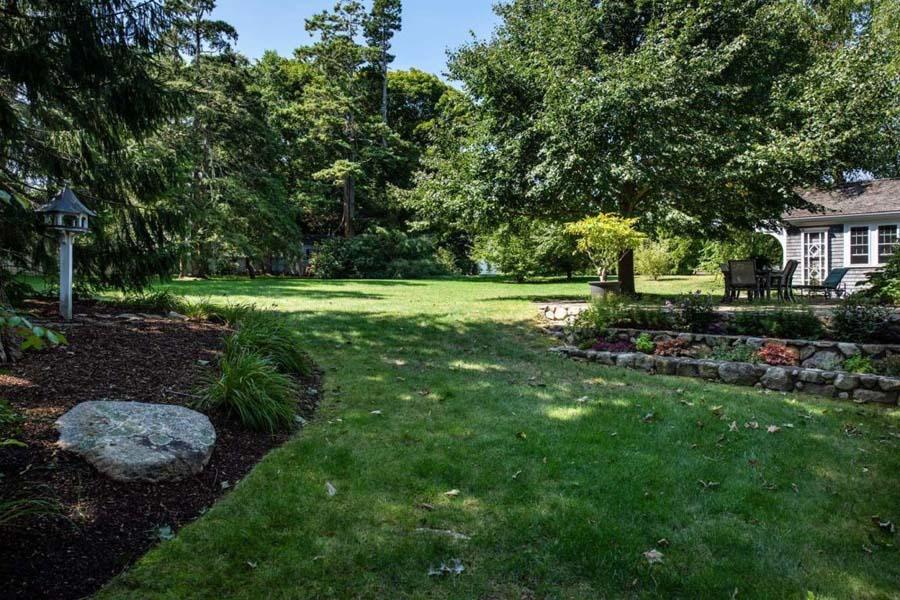 149 East Bay Road Osterville, MA 02655 - Photo 9 of 39 a view of backyard with green space