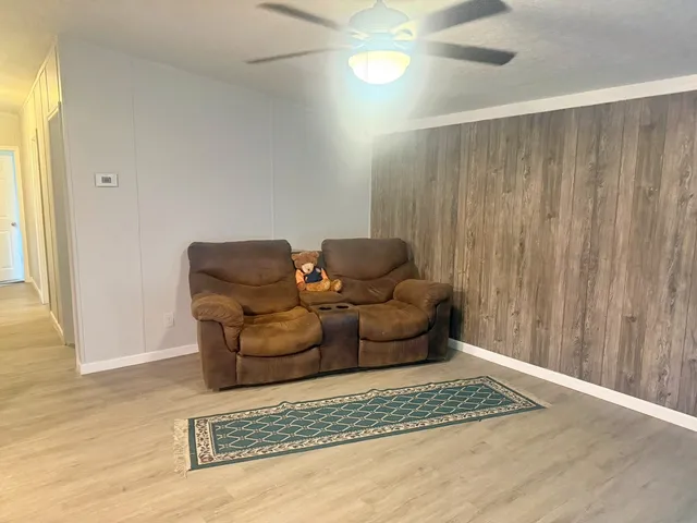 a living room with furniture and a rug