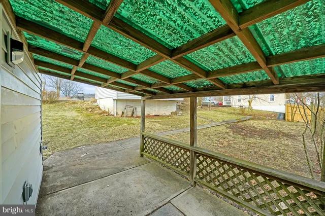 a front view of a house with large garden