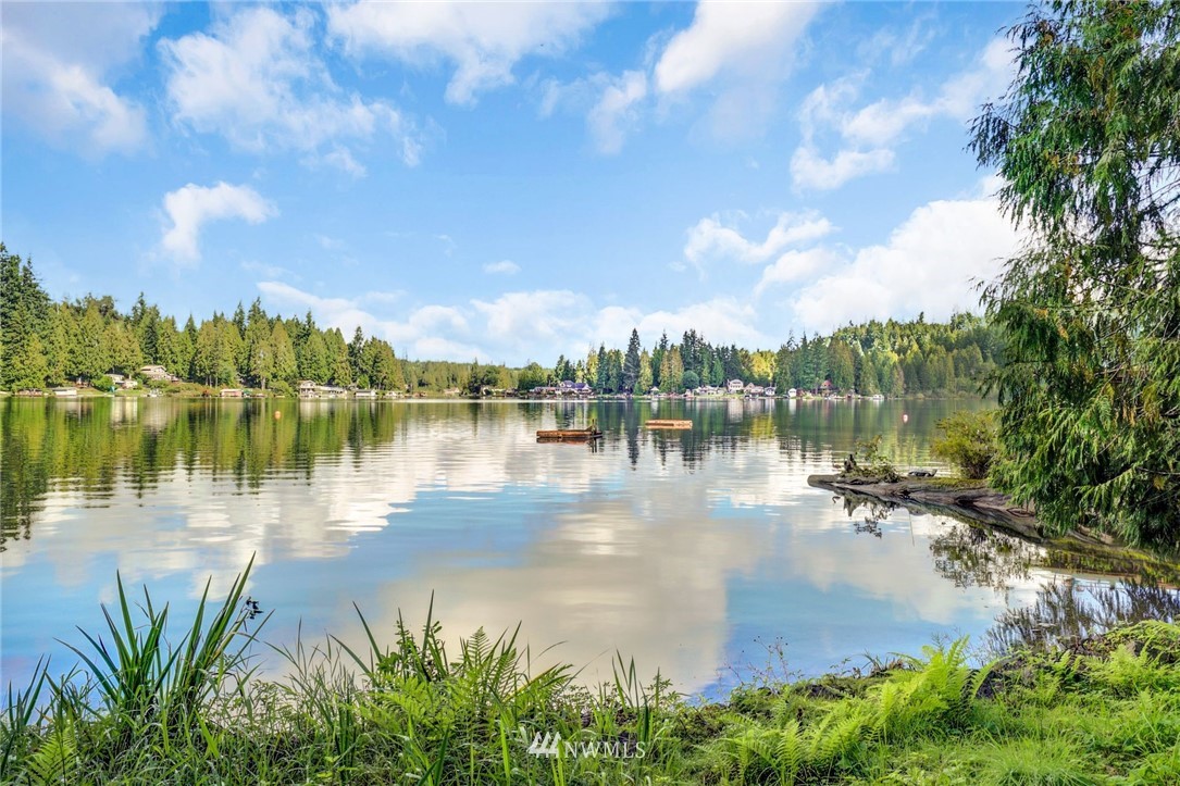 2430 South Lake Roesiger Road Snohomish, WA 98290 - Photo 3 of 12 a view of a lake with a big yard