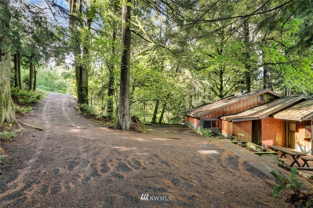 2430 South Lake Roesiger Road Snohomish, WA 98290 - Photo 7 of 12 a view of a house with large trees