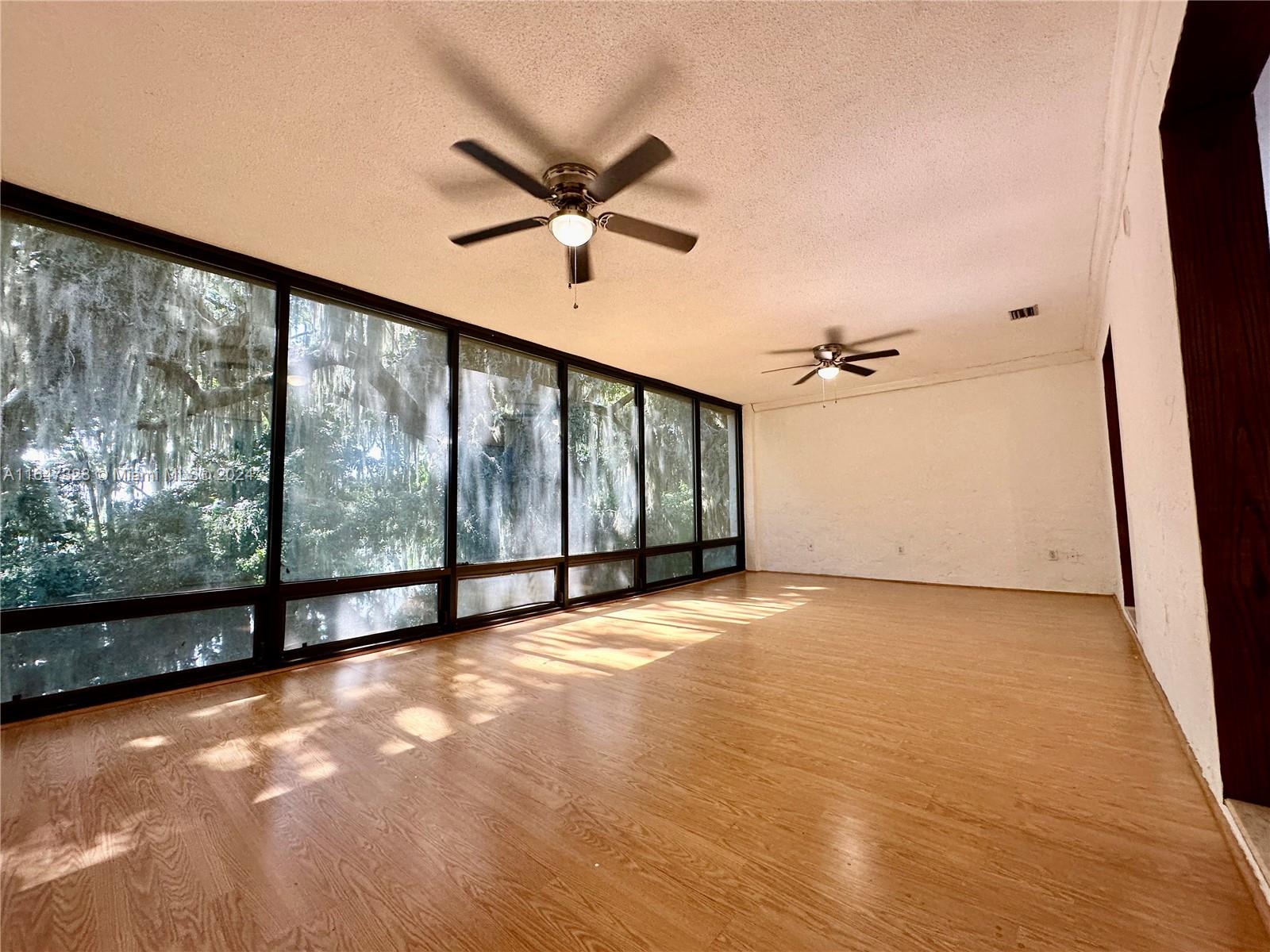 2816 Southwest 14th Drive, Unit 2816 Gainesville, FL 32608 - Photo 1 of 14 a view of an empty room with a window