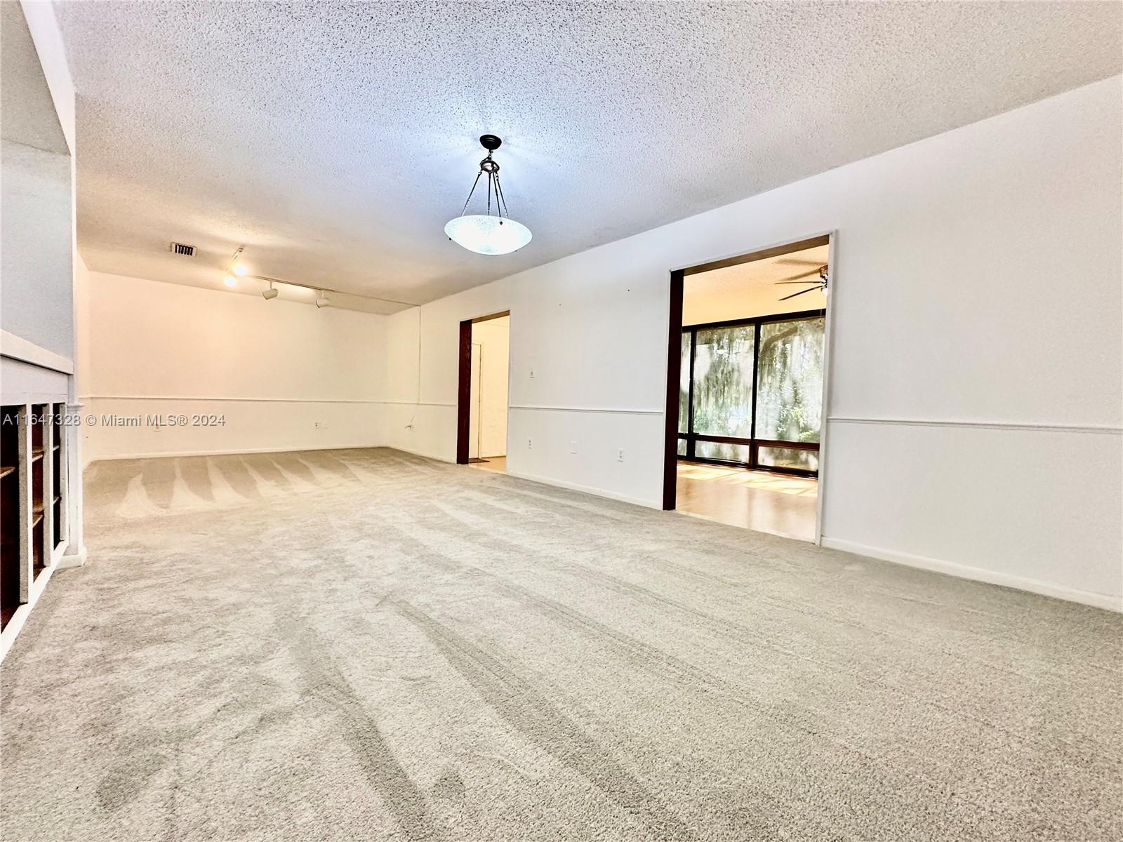 2816 Southwest 14th Drive, Unit 2816 Gainesville, FL 32608 - Photo 3 of 14 a view of an empty room with a window
