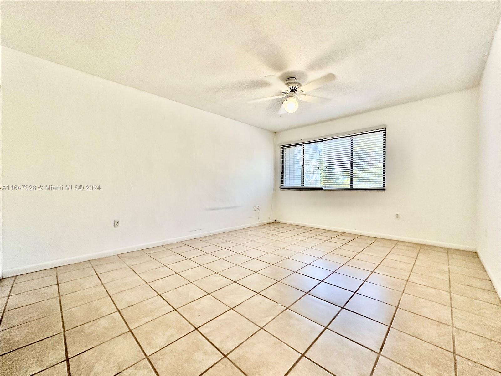 2816 Southwest 14th Drive, Unit 2816 Gainesville, FL 32608 - Photo 9 of 14 a view of an empty room and window