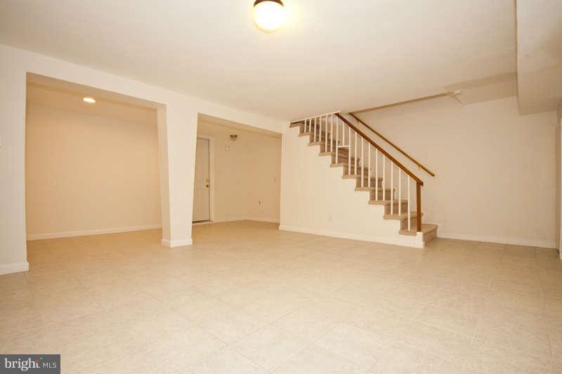 1505 Northgate Road Baltimore, MD 21218 - Photo 17 of 24 a view of an empty room with stairs