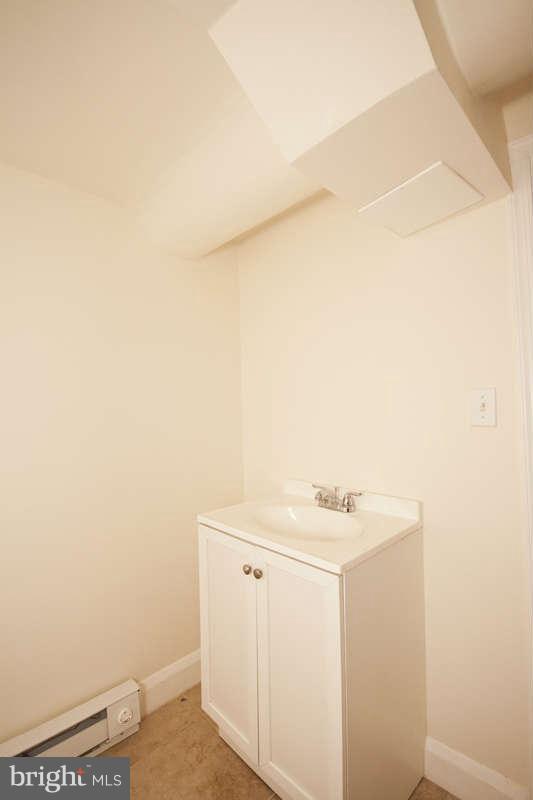 1505 Northgate Road Baltimore, MD 21218 - Photo 21 of 24 a bathroom with a sink and vanity