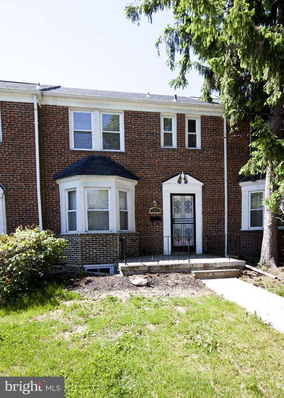 1505 Northgate Road Baltimore, MD 21218 - Photo 23 of 24 a front view of a house with a yard