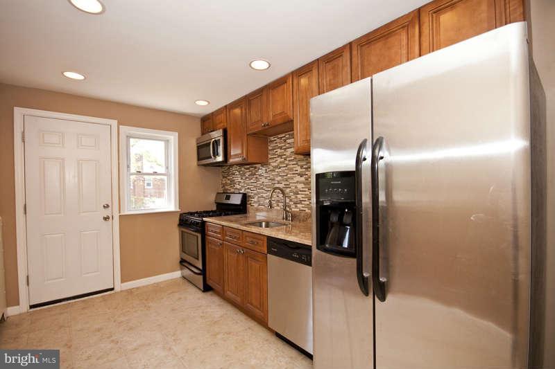 1505 Northgate Road Baltimore, MD 21218 - Photo 7 of 24 a kitchen with stainless steel appliances granite countertop a refrigerator and a sink