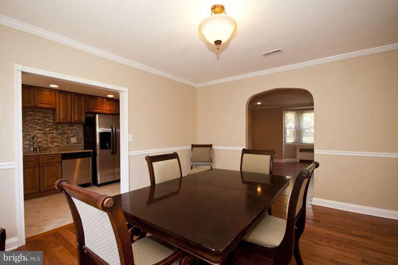 1505 Northgate Road Baltimore, MD 21218 - Photo 8 of 24 a view of a dining room with furniture and wooden floor