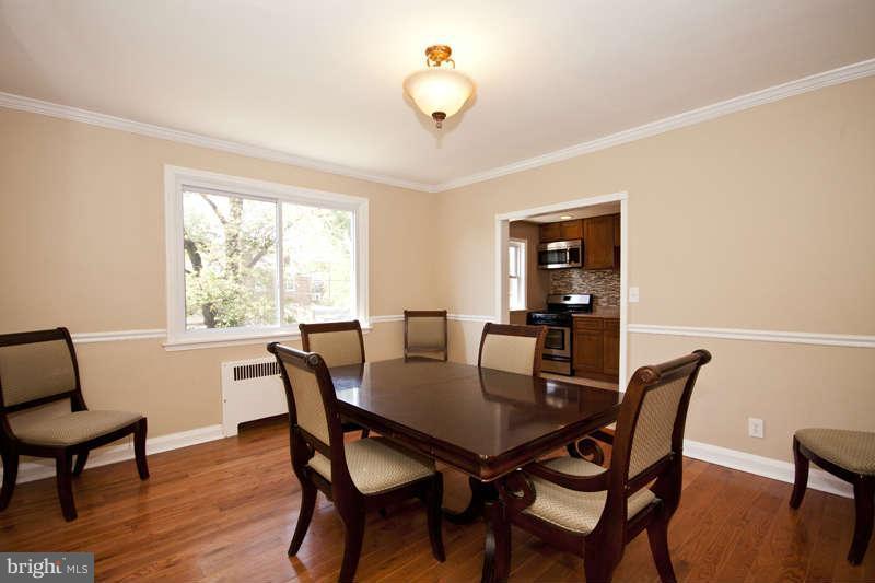 1505 Northgate Road Baltimore, MD 21218 - Photo 9 of 24 a view of a dining room with furniture window and wooden floor
