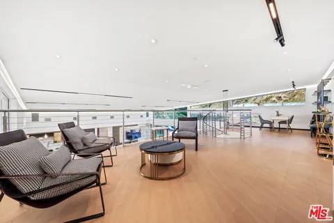 a living room with furniture and water view