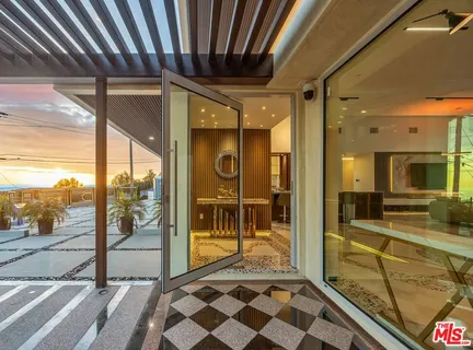 a view of a bathroom with a shower and a sink