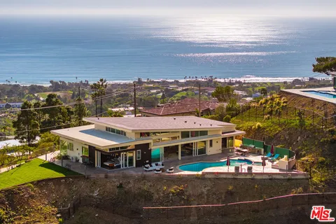 a view of a city that has lawn chairs