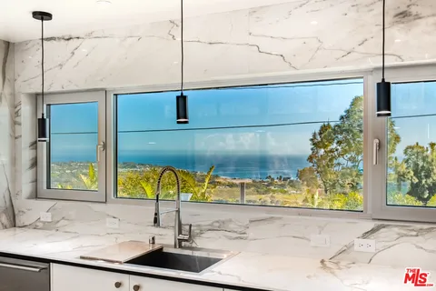 a sink sitting next to a window