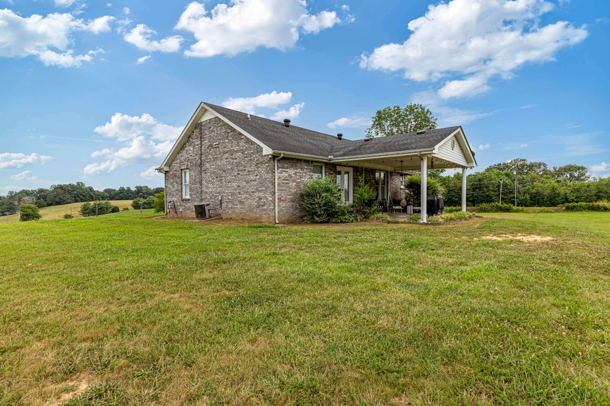 6150 Highway 41 A Pleasant View, TN 37146 - Photo 14 of 34 a front view of a house with garden
