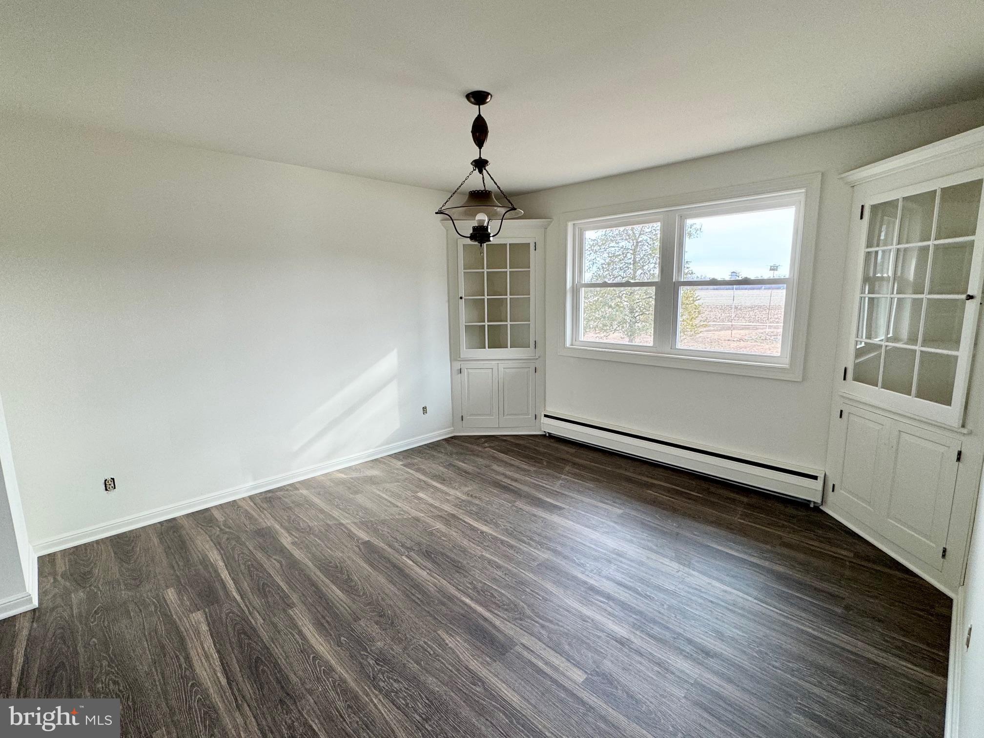 643 Chatsworth Road Tabernacle, NJ 08088 - Photo 14 of 27 wooden floor in an empty room with a window