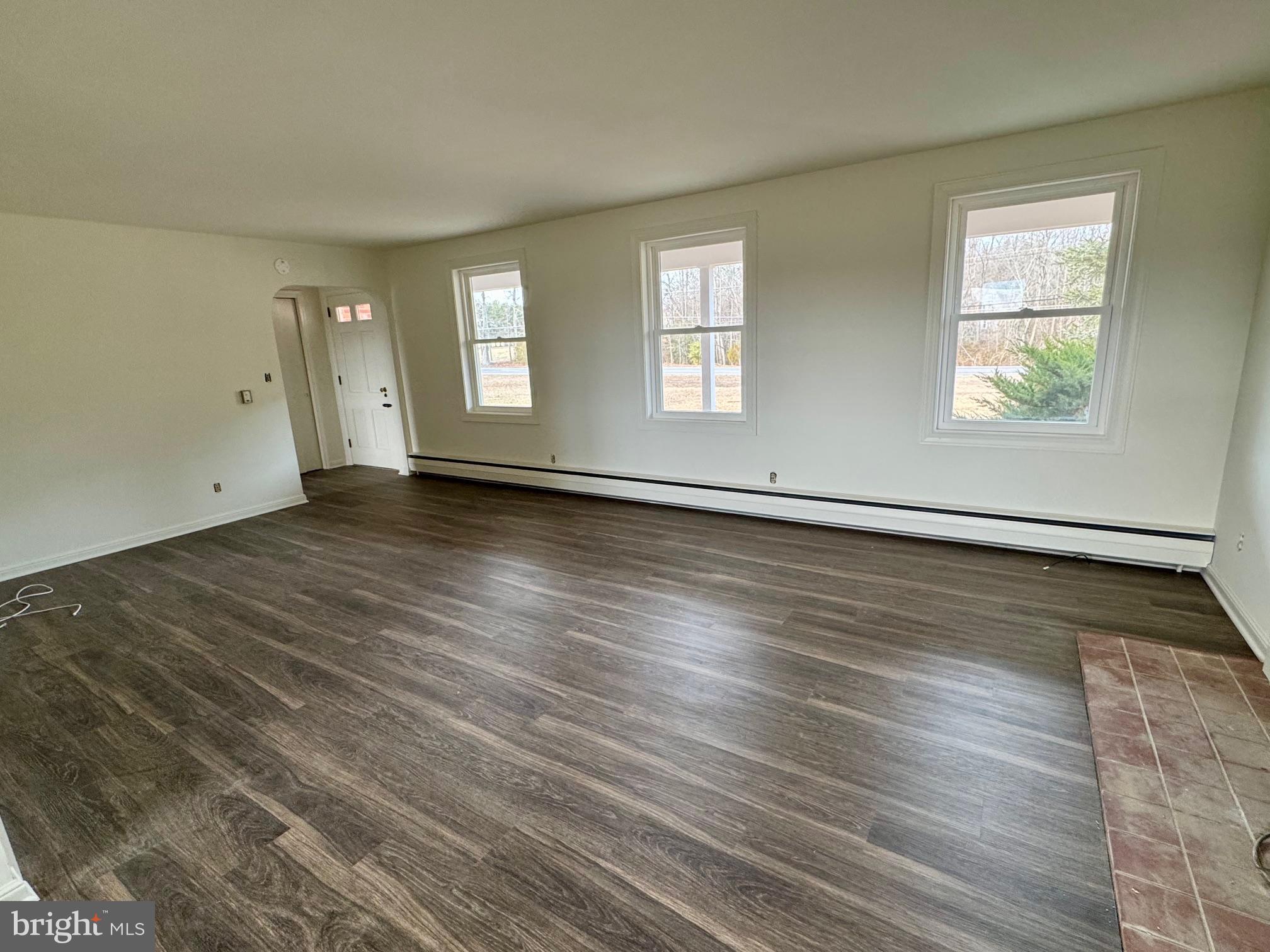 643 Chatsworth Road Tabernacle, NJ 08088 - Photo 15 of 27 an empty room with wooden floor and windows