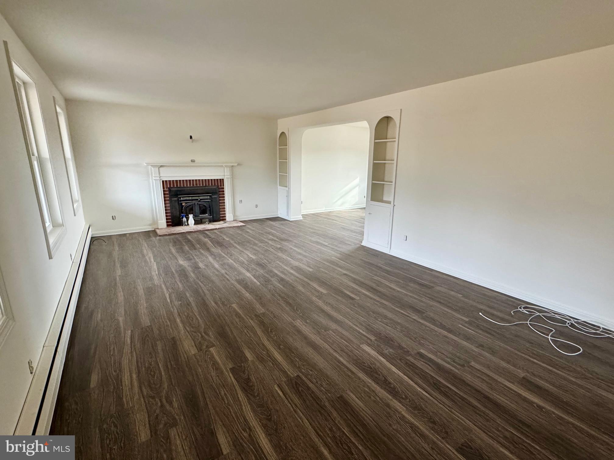 643 Chatsworth Road Tabernacle, NJ 08088 - Photo 16 of 27 a view of empty room with wooden floor and fireplace