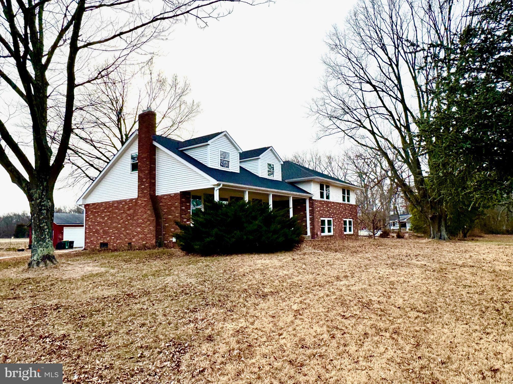 643 Chatsworth Road Tabernacle, NJ 08088 - Photo 3 of 27 a view of a house with a yard covered in snow