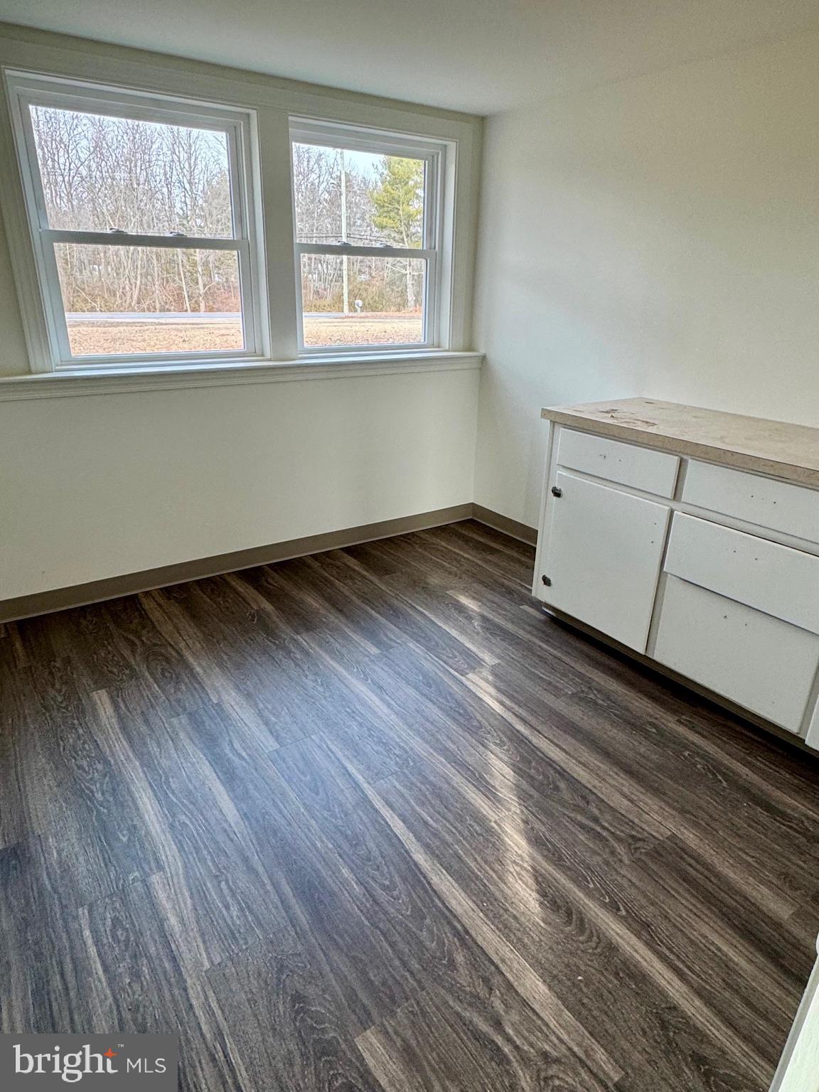 643 Chatsworth Road Tabernacle, NJ 08088 - Photo 7 of 27 an empty room with wooden floor and windows