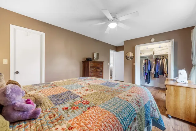 a bed room with a bed and a mirror