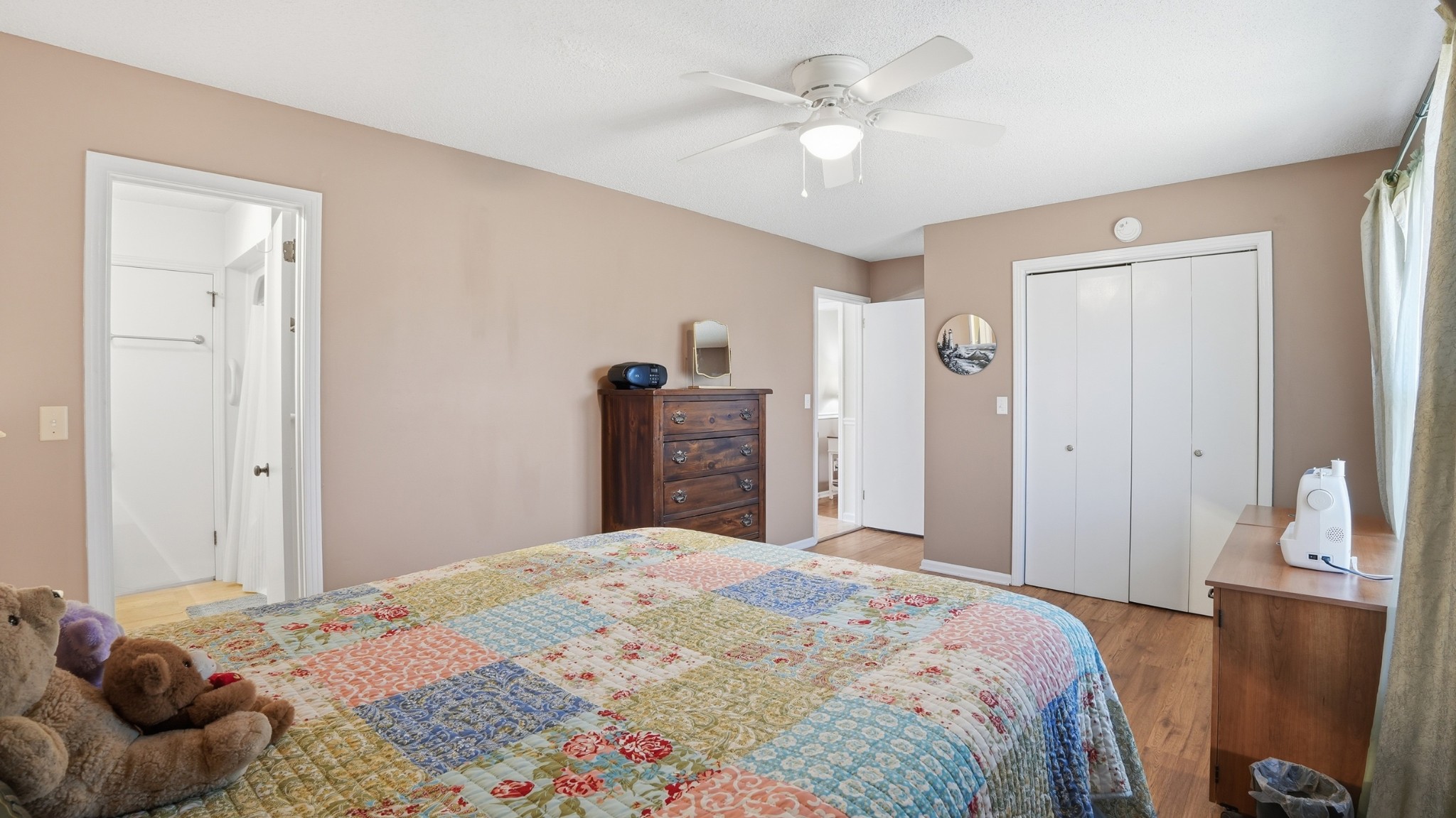 509 12 Oaks Road Tullahoma, TN 37388 - Photo 22 of 60 a bedroom that has a bed and a chandelier