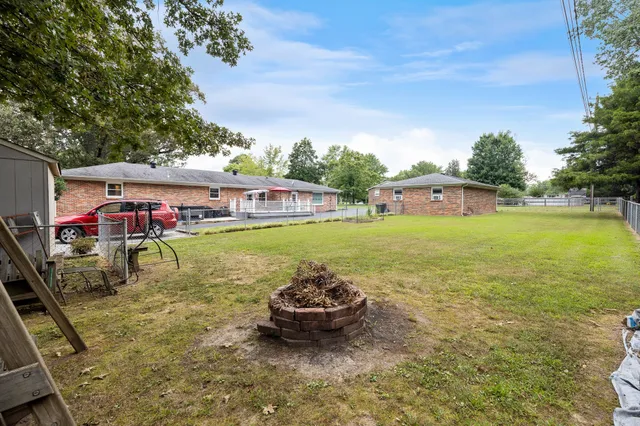 swimming pool with outdoor seating and garden