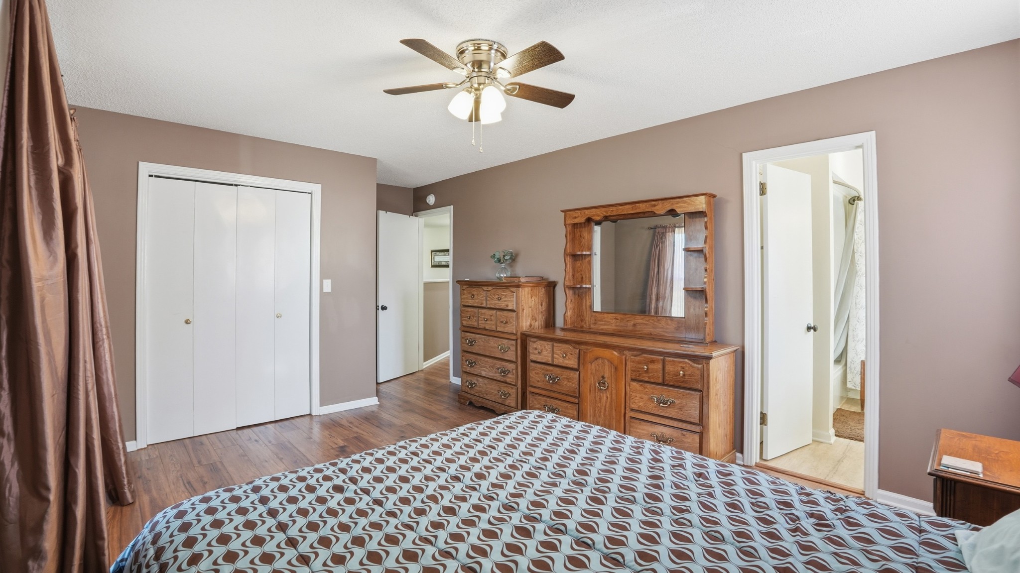 509 12 Oaks Road Tullahoma, TN 37388 - Photo 35 of 60 a bedroom with a bed and a chandelier